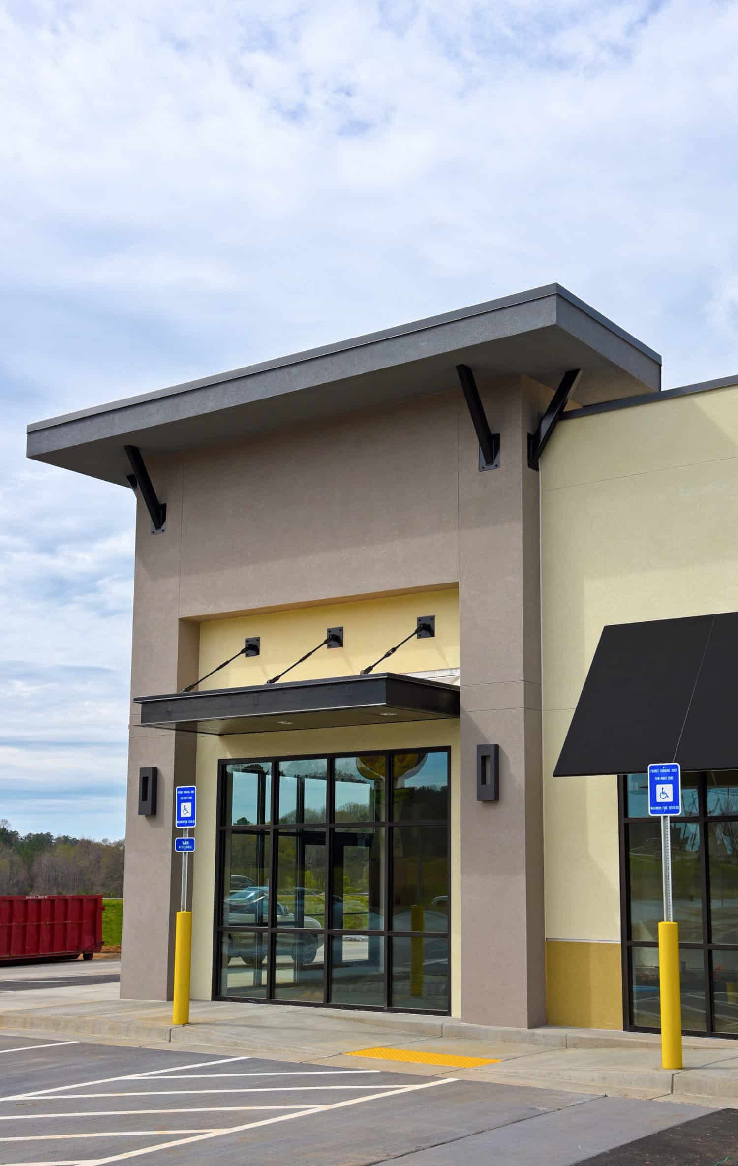 Modern commercial building with professional multi-tone exterior paint by APEX Coating Services