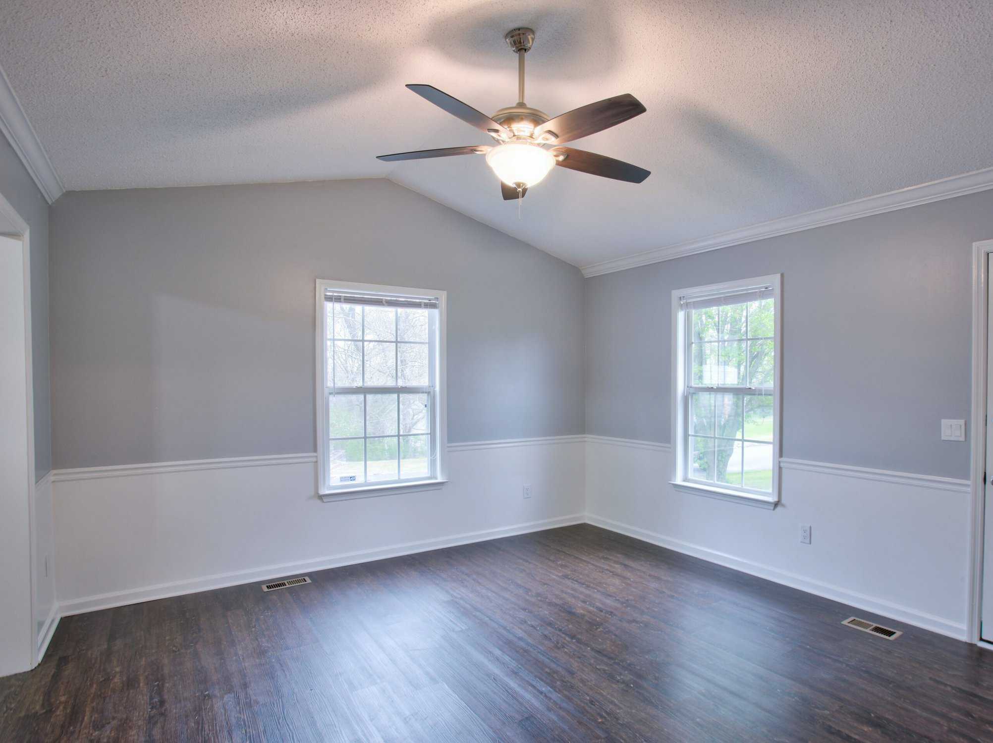 Freshly painted interior room with professional two-tone wall finish by APEX Coating Services