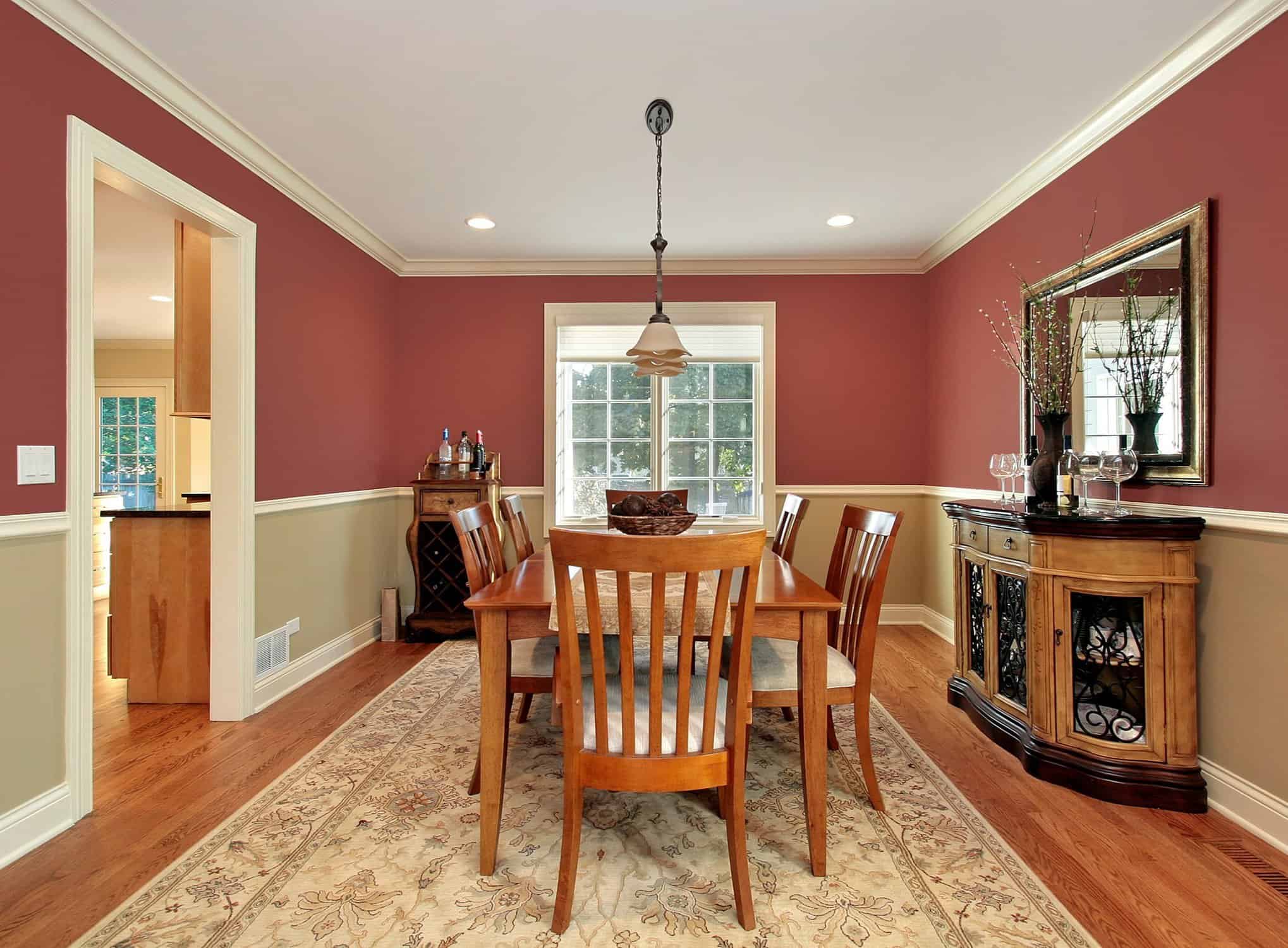 Elegant dining room with professional two-tone wall painting by APEX Coating Services - interior color transformation